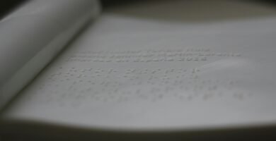 a close up of an open book with writing on it